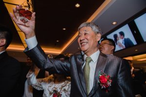 Bride's father raising a toast